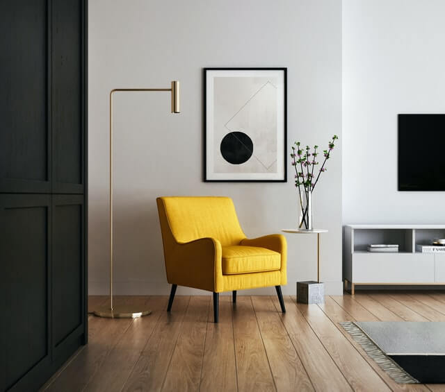 Inside image of a house with yellow color chair