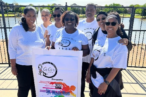 A group of people standing together posing for a photo